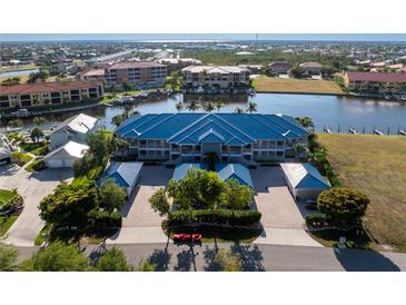 Aerial view of waterfront property with private boat slips at 3311 Wood Thrush Dr # 126, Punta Gorda, FL 33950