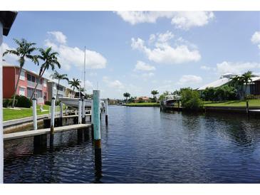 Peaceful canal view with boats and lush greenery at 2000 Bal Harbor Blvd # 1012, Punta Gorda, FL 33950