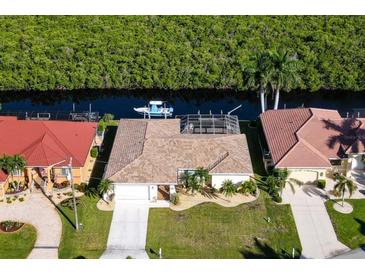 Canal front home with private dock and lush landscaping at 729 Macedonia Dr, Punta Gorda, FL 33950
