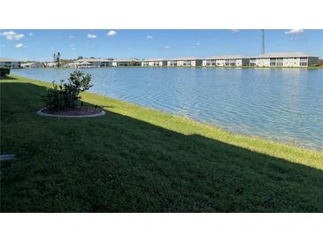 Backyard oasis with a lake view at 3310 Loveland Blvd # 604, Port Charlotte, FL 33980