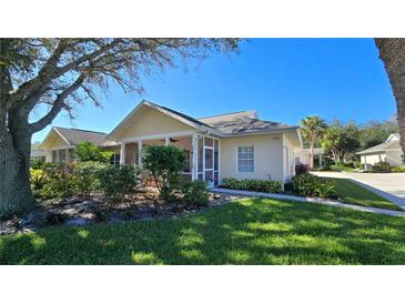 Cute one-story home with screened porch and landscaped yard at 1307 Red Oak Ln, Port Charlotte, FL 33948