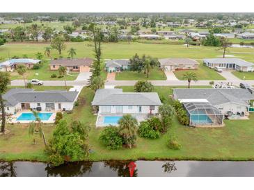 Bird's eye view of property and surrounding neighborhood at 25 Caddy Rd, Rotonda West, FL 33947