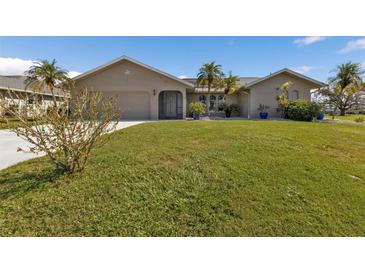 Two-story home with attractive landscaping at 2328 Bonn Ct, Punta Gorda, FL 33983