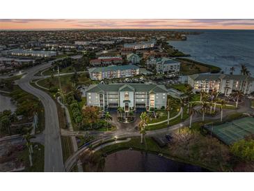 Luxury condo building with water access and tennis courts at 1250 W Marion Ave # 141, Punta Gorda, FL 33950