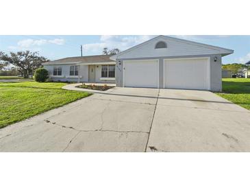 Single story home with two car garage and well maintained lawn at 8109 San Jacinto Ave, North Port, FL 34287