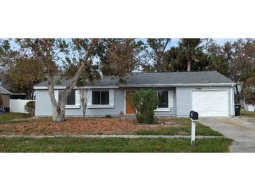 Newly painted exterior of a single story home with a spacious yard at 4440 Mongite Rd, North Port, FL 34287