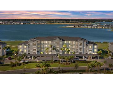 Luxury condo building with lake views and covered parking at 43050 Greenway Blvd # 614, Punta Gorda, FL 33982