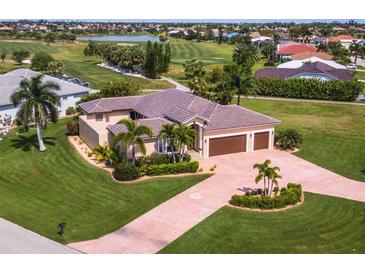 Single-Gathering home with three-car garage, golf course view at 300 Madrid Blvd, Punta Gorda, FL 33950