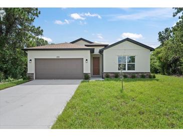 A charming single-story house with a brown garage door at 4131 Bula Ln, North Port, FL 34287