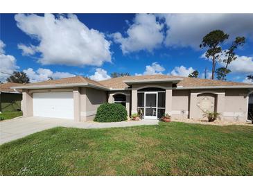 One-story home with a screened porch and well-manicured lawn at 2250 Villa Green Ave, North Port, FL 34288