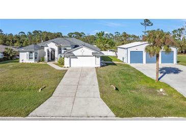 House and detached garage, ample parking at 17152 Wintergarden Ave, Port Charlotte, FL 33948