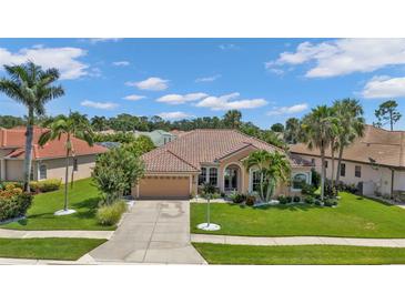 Attractive single-story home with tile roof, landscaping, and two-car garage at 2388 Silver Palm Rd, North Port, FL 34288