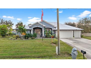 Spacious house with a large yard and three car garage at 2363 Homestead Cir, North Port, FL 34286