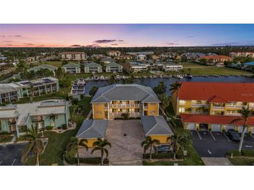 Aerial view of waterfront community, showing building and surrounding landscape at 3216 Purple Martin Dr # 122, Punta Gorda, FL 33950