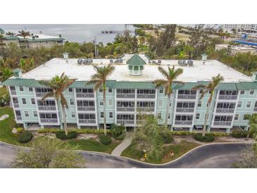 Coastal three-story building with balconies and waterfront views at 5115 Melbourne St # A206, Punta Gorda, FL 33980