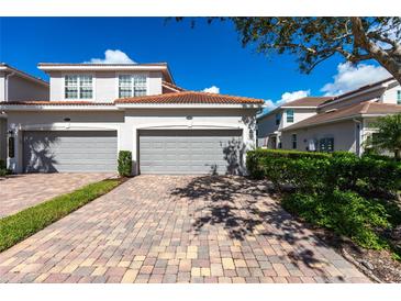 Townhouse with two-car garage and brick paver driveway at 14009 Black Beauty Dr # 212, Punta Gorda, FL 33955