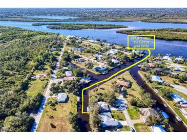 Stunning aerial view of waterfront homes with direct access to open waters, a boater's paradise in a serene setting at 28427 Sabal Palm Dr, Punta Gorda, FL 33982