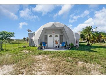 Unique dome-shaped home with a spacious yard at 15871 Huffmaster Rd, North Fort Myers, FL 33917