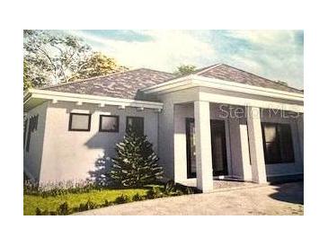 Single-story home with modern design, covered entry, and landscaped yard at 24089 N Peppercorn Rd, Punta Gorda, FL 33955