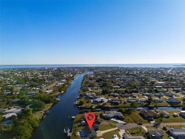 Gorgeous waterfront property with private boat dock and stunning views of the canal and open bay from above at 130 Arlington Ne Ct, Port Charlotte, FL 33952