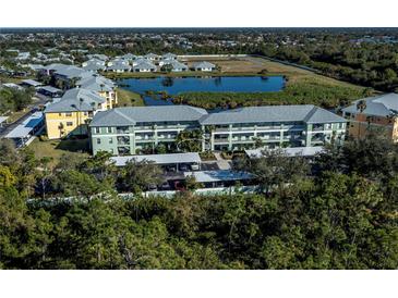 Aerial view of condo community near lake at 2160 Heron Lake Dr # 104, Port Charlotte, FL 33983