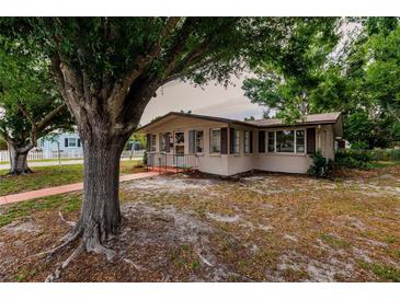 Charming single story home with mature landscaping and a spacious front yard at 515 W Olympia Ave, Punta Gorda, FL 33950