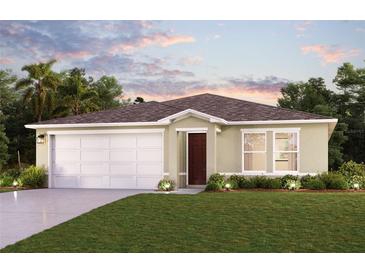 Single-story home with a two-car garage and landscaped lawn at 25364 Cadiz Dr, Punta Gorda, FL 33955