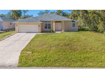Newly constructed single-story home with attached garage and large yard at 267 Lecturn St, Port Charlotte, FL 33954
