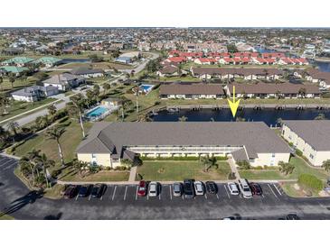 Aerial view of waterfront condo community with pool and boat slips at 4000 Bal Harbor Blvd # 126, Punta Gorda, FL 33950