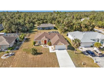 Single Gathering home with driveway and mature landscaping at 4061 Atwater Dr, North Port, FL 34286