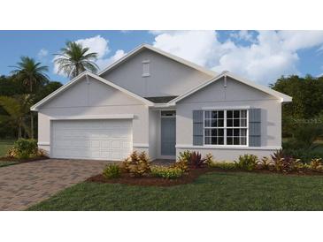Attractive single-story home with gray siding, white garage door, and landscaping at 1428 Powell Valley Dr, Port Charlotte, FL 33953