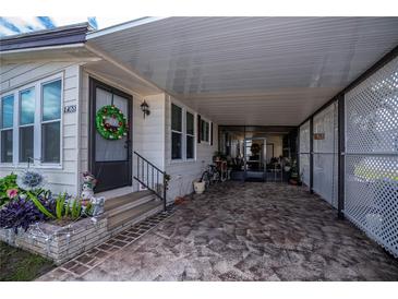 Florida mobile home with carport and landscaped yard at 368 Catamaran Ct, North Port, FL 34287