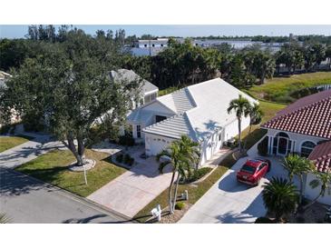 Aerial view of a single-story home with a tile roof and a two-car garage at 10208 Arrowhead Dr, Punta Gorda, FL 33955