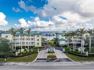 Aerial view of waterfront community with lush landscaping and gated entrance at 5116 Melbourne St # B201, Punta Gorda, FL 33980