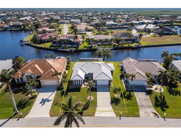 Aerial view showing the house's location in a waterfront community at 525 Madrid Blvd, Punta Gorda, FL 33950