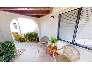 Charming patio with beautiful plants and seating perfect for relaxing outdoors at 3830 Bal Harbor Blvd # 5, Punta Gorda, FL 33950