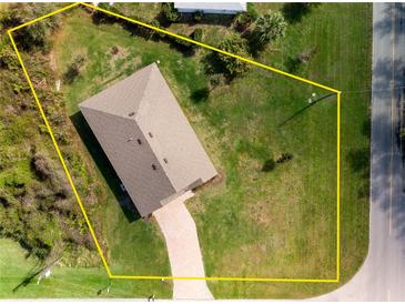 Aerial shot with property boundary lines, and spacious lawn at 616 Posadas Cir, Punta Gorda, FL 33983