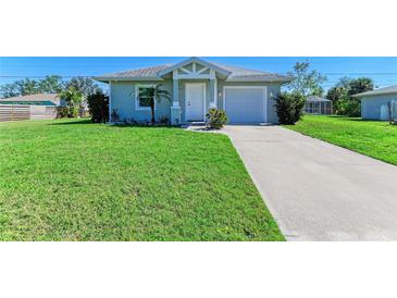 Charming single-story home featuring a well-manicured lawn and attached one car garage at 315 Southland Rd, Venice, FL 34293