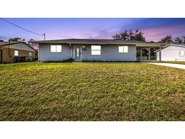 Charming single-story home with a well-maintained lawn and inviting curb appeal, perfect for families at 5211 Prime Ter, North Port, FL 34286