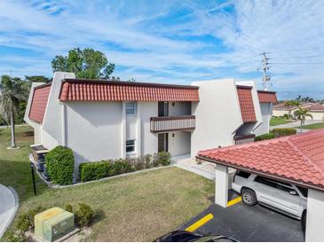 Attractive condo with red tile roof and covered parking at 311 Garvin St # 401C, Punta Gorda, FL 33950