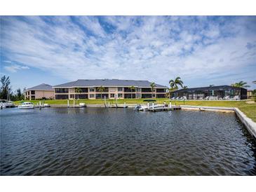 Waterfront condominiums with docks and swimming pool offer a serene and luxurious living experience at 3256 White Ibis Ct # 13B, Punta Gorda, FL 33950