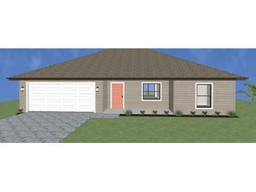 Charming one-story home with a two-car garage and a well-maintained front yard at 17331 Elmwood Ave, Port Charlotte, FL 33948