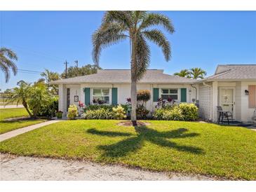 Charming single-story home with a well-manicured lawn and lush landscaping in a serene neighborhood at 196 The Corso # 196, Venice, FL 34285