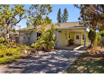 Charming single-story home with lush landscaping and a welcoming front entrance, perfect for serene living at 1060 Venetian Pkwy, Venice, FL 34285