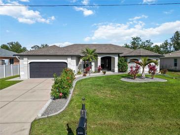 Charming single-story home with well-manicured lawn and inviting curb appeal in a quiet neighborhood at 1508 Westover St, Port Charlotte, FL 33953