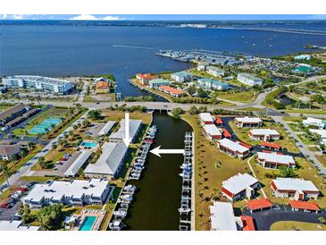 Stunning aerial view of waterfront community with boat docks and access to the Gulf of Mexico at 220 Coldeway Dr # 211, Punta Gorda, FL 33950