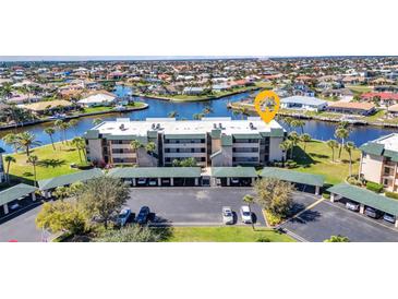 Waterfront condo with canal views, covered parking, and easy access to community amenities at 601 Shreve St # 36C, Punta Gorda, FL 33950