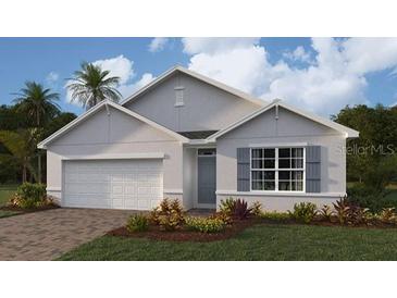 Charming single-story home with manicured landscaping and a two-car garage, perfect for modern living at 16290 Maya Cir, Punta Gorda, FL 33955
