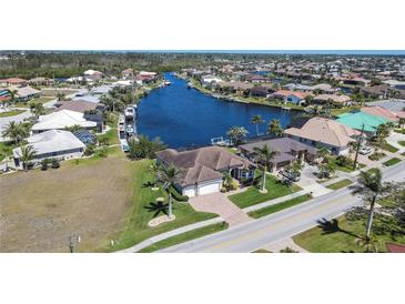Beautiful waterfront homes featuring canals and boat docks in a desirable residential neighborhood at 3606 Whippoorwill Blvd, Punta Gorda, FL 33950
