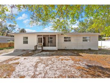 Single-story home featuring a screened-in entryway and neutral paint, awaiting a personal touch at 102 21St Ne St, Bradenton, FL 34208